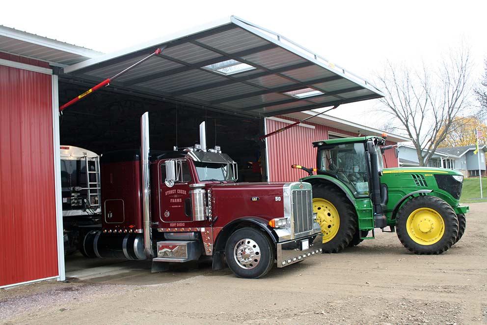 A machine shed storing Semi-Trucks and Tractors